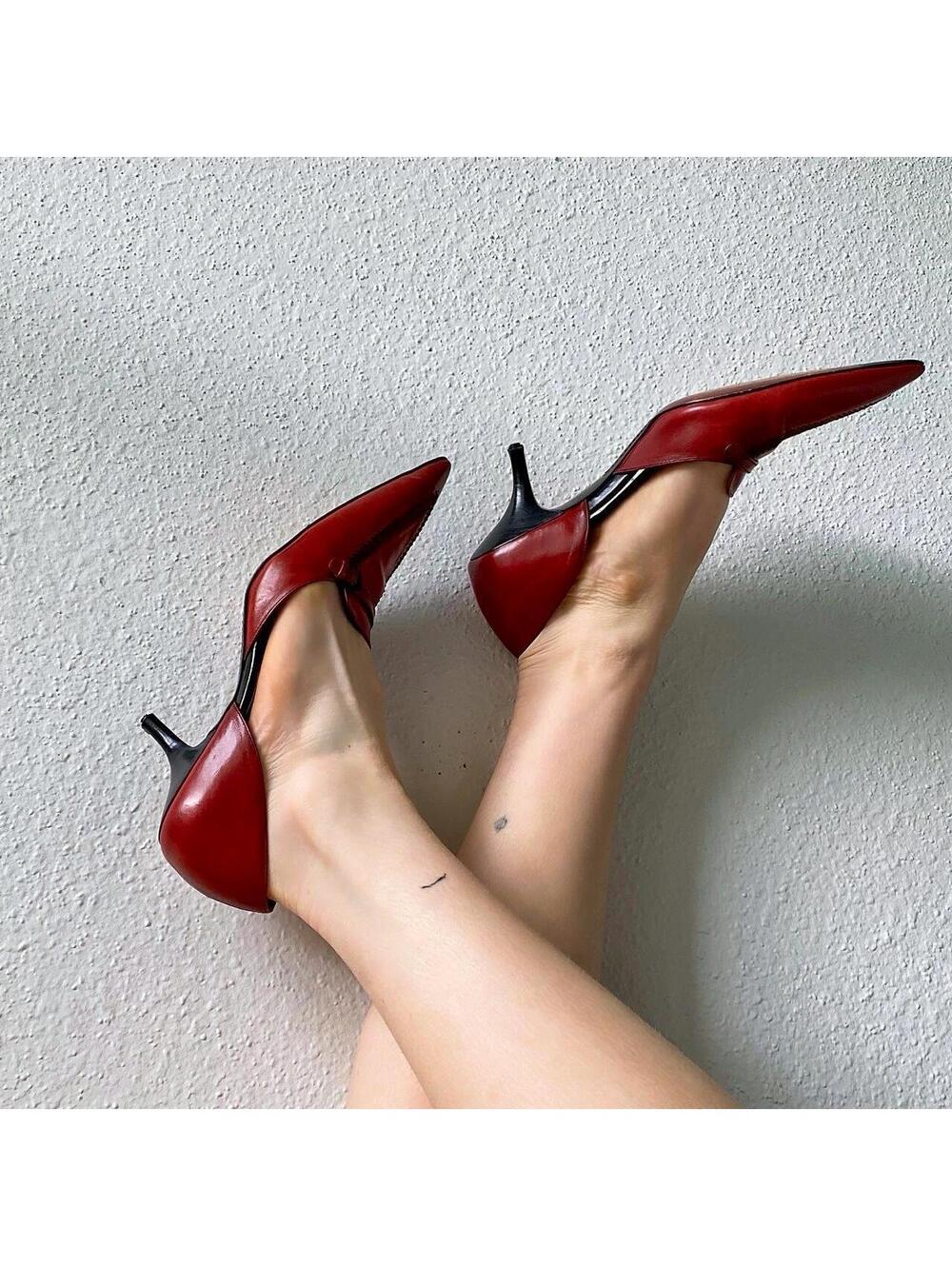 beautiful red leather pointy toe kitten heels with black accents and stitching